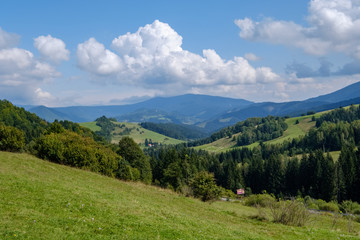 western carpathian Tatra mountain skyline with green fields and forests in foreground