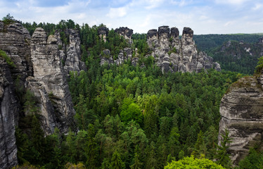 Fototapeta na wymiar Rock formations of the Elbe sandstone mountains around the Bastei bridge in Saxony, Germany