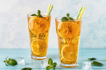 Iced tea with lemon slices and mint.