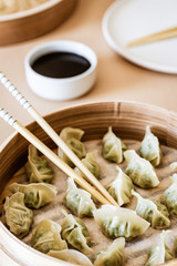 Asian gyoza, dumplings snack, chopsticks, steamer