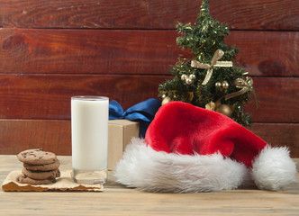 Obraz na płótnie Canvas Christmas background with milk and cookies to Santa
