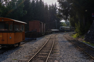 ancient log wood railway and train on the tracks