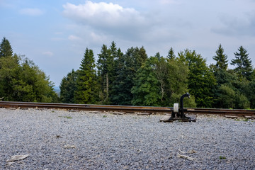 Fototapeta na wymiar ancient log wood railway and train on the tracks