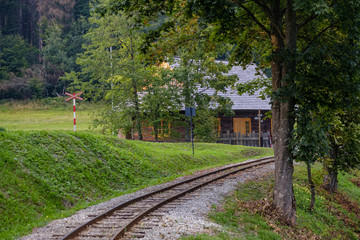 Fototapeta premium ancient log wood railway and train on the tracks