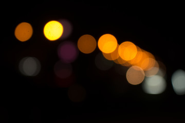 Defocused city night filtered bokeh abstract background