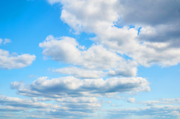 Porous clouds in the blue sky. Nature background.