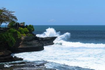 Landscape of huge white Indian ocean wave splash to to the cliff in Bali, Indonesia