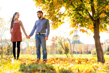 couple in love walking in autumn park