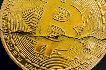 Crack bitcoin closeup, cryptocurrency decline