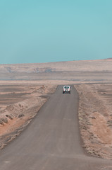 car on the road at the desert