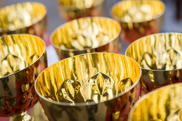 Golden cups on the table 