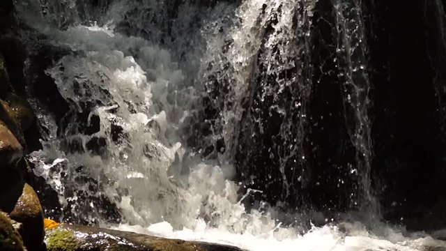 rocky mountain river splashing water flowing downstream