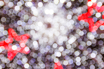 Christmas light background. Holiday glowing backdrop. Defocused Background