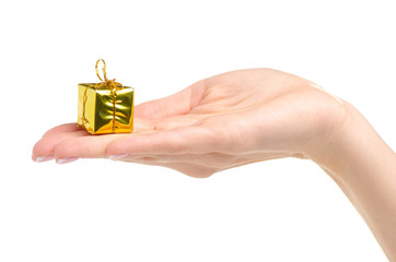 Christmas toys golden gifts box in hand on a white background. Isolation