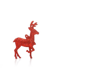 Christmas toy red deer on a white background. Isolation