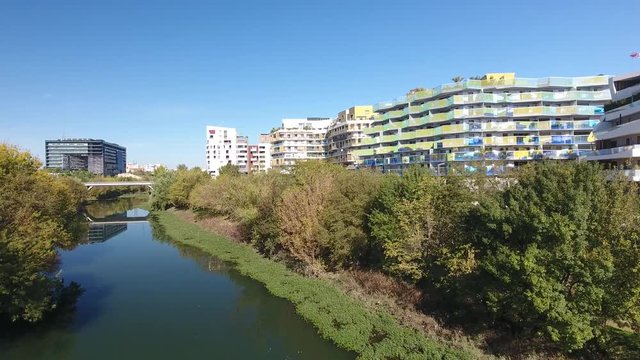 River le lez in Montpellier with urban residential building drone view