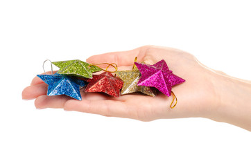 Christmas toys stars in hand on a white background. Isolation