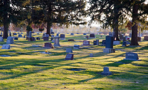 cemetery at sunset, cemetery, gravestones, markers, death, died, grass,shadows, granite, stone, plots 