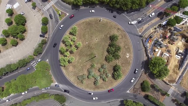 Fix drone vertical view over a roundabout in France. Traffic urban zone