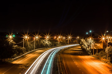 Fototapeta na wymiar Night lights blurred on the highway