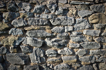 the texture of an old masonry with sutures