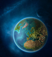 Planet Earth with highlighted Belgium in space with Moon and Milky Way. Visible city lights and country borders.