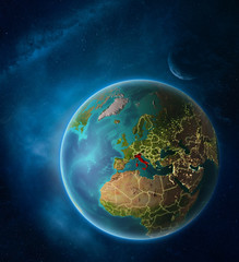 Planet Earth with highlighted Italy in space with Moon and Milky Way. Visible city lights and country borders.