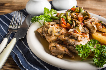 Fillet of chicken legs with stewed vegetables.