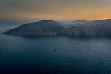 Fototapeta na wymiar yacht in bay dawn