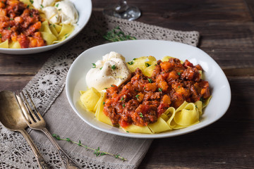 Pappardelle pasta with meat ragout and burrata cheese