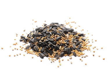 Mixed seeds, sunflower, millet, hemp, oats pile and minerals for exotic birds, parrots. Isolated on white background
