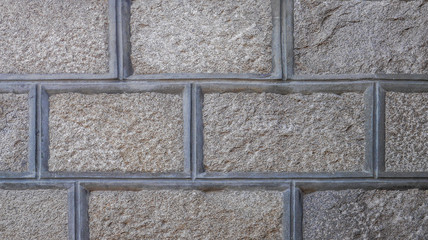Unusual and interesting concrete and stone tiles for background or texture. Gray concrete frame with rock interior.