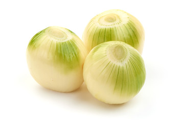 Fresh bulbs of onion, cleared, isolated on a white background. Close-up