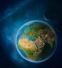 Planet Earth with highlighted Jordan in space with Moon and Milky Way. Visible city lights and country borders.