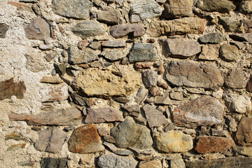Ancient dry stone wall bricks texture close up view