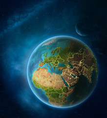 Planet Earth with highlighted Lebanon in space with Moon and Milky Way. Visible city lights and country borders.