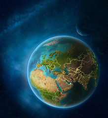 Planet Earth with highlighted Armenia in space with Moon and Milky Way. Visible city lights and country borders.