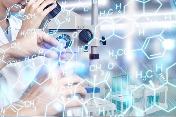 Female Scientist Working with Microscope in Laboratory