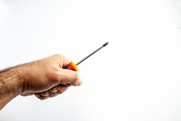 worker's hand with screwdriver in hand