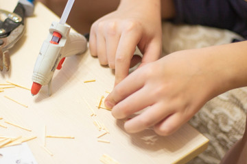 Obraz na płótnie Canvas hands of the boy close-up making crafts5.jpg