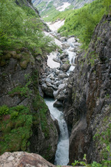 Fototapeta na wymiar The Alibek Waterfall. Dombay Mountains. The Northern Caucas mountain landscapes