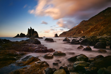 view of wild Benijo beach with big waves and black sand on the north coast of the Tenerife island, Spain