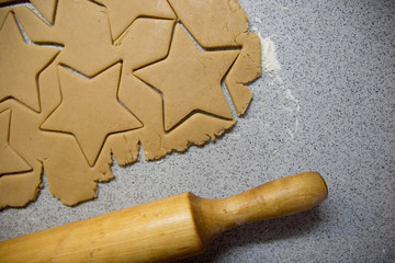 Cooking Christmas gingerbread cookies on a grey background