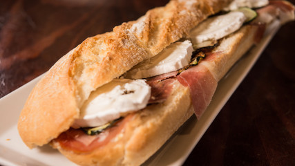 Goat cheese and cured ham sandwich