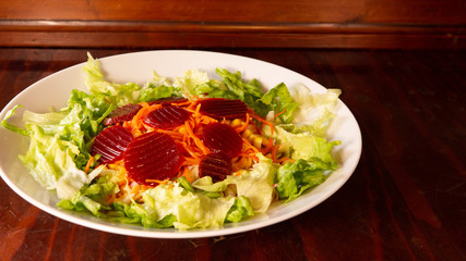Beet salad with carrot and lettuce