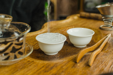 Chinese tea ceremony with Anchnag on wooden background