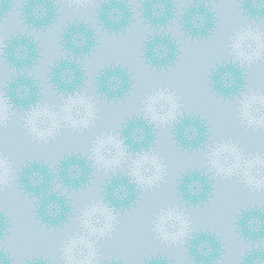 Winter seamless pattern with chaotic snowflakes in different shades of blue color