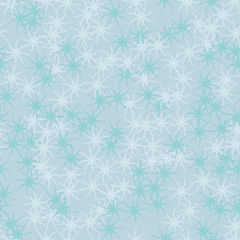 Winter seamless pattern with chaotic snowflakes in different shades of blue color
