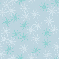 Winter seamless pattern with chaotic snowflakes in different shades of blue color