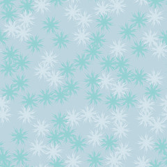 Winter seamless pattern with chaotic snowflakes in different shades of blue color